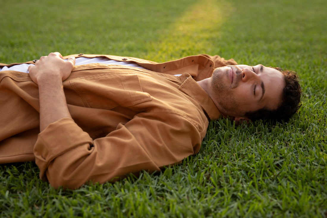 Man sleeping on the grass outside